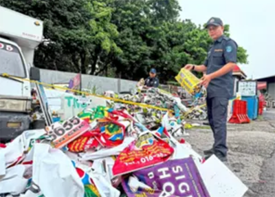 MBDK enforcement officer Alim Othman showing some of the illegal advertisements removed from public areas at the council’s yard in Klang.